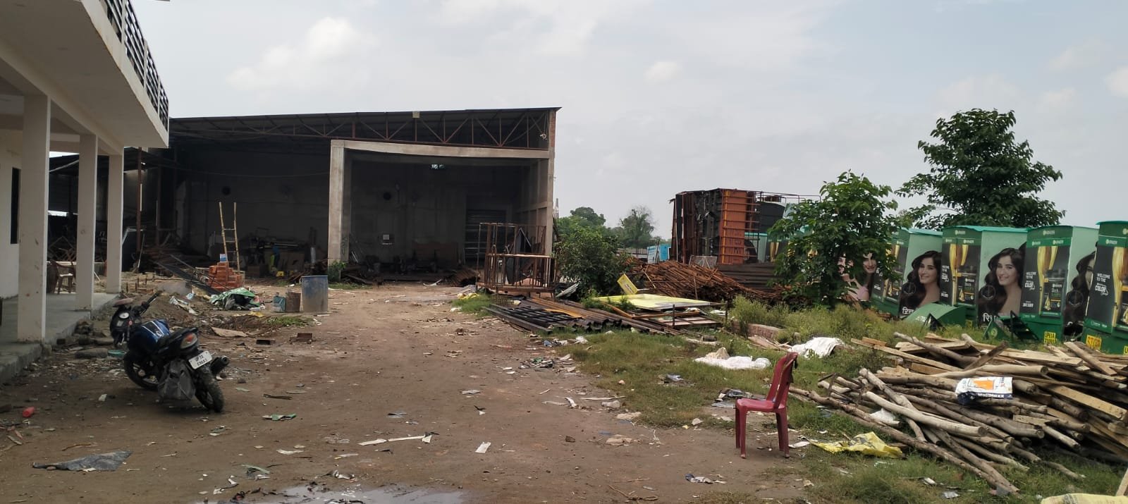 Workers fabricating hoarding structures on the workshop floor
