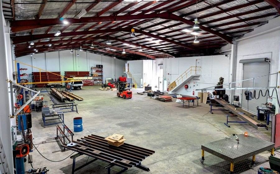 Workers building structures inside Rudra's in-house fabrication workshop