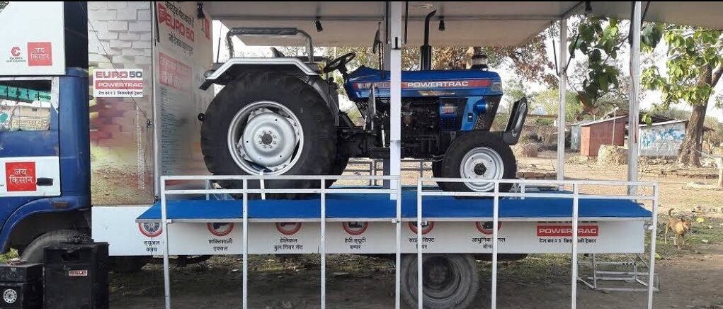 Escorts Powertrac tractor demo platform at a rural farm activation