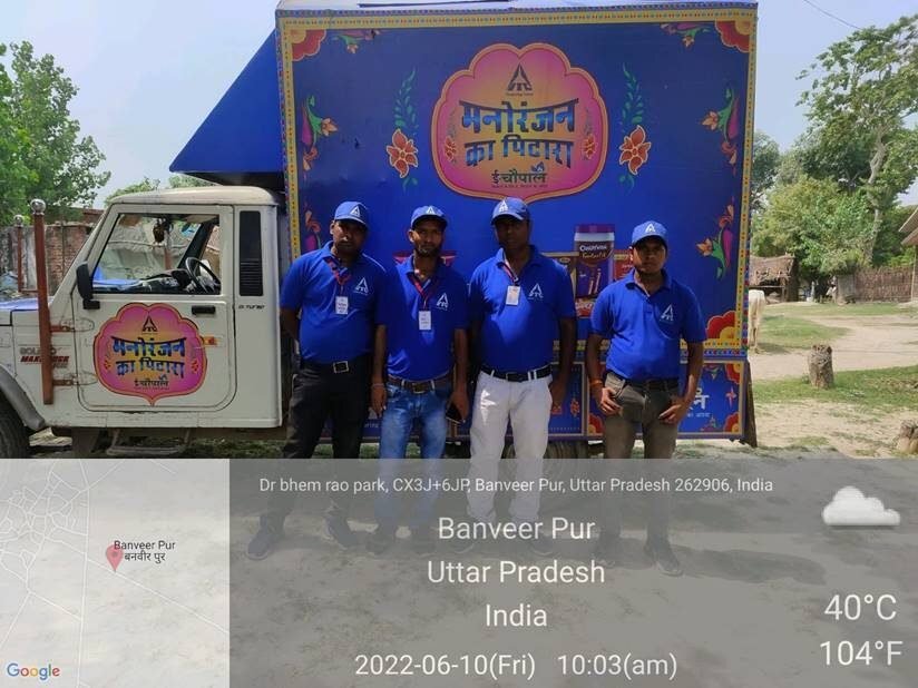 Branded rural mobile promotional van and team on-ground in a village