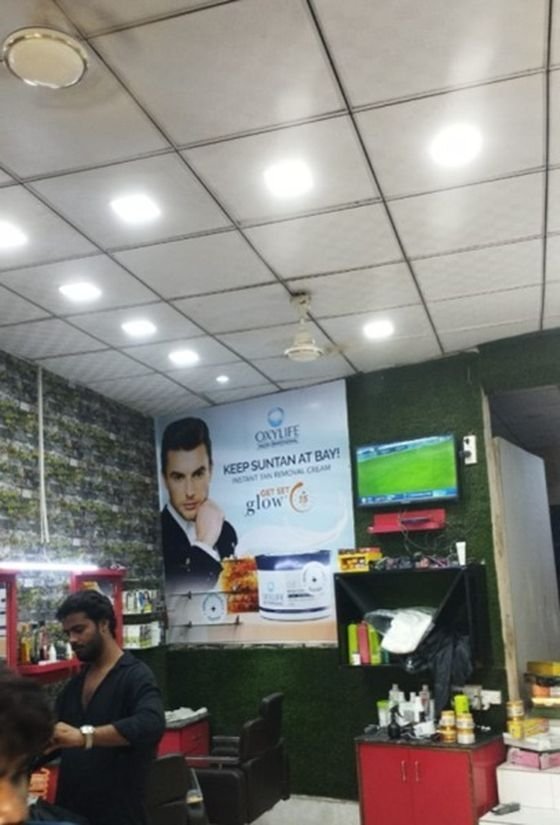 Oxylife in-shop branding poster inside a salon
